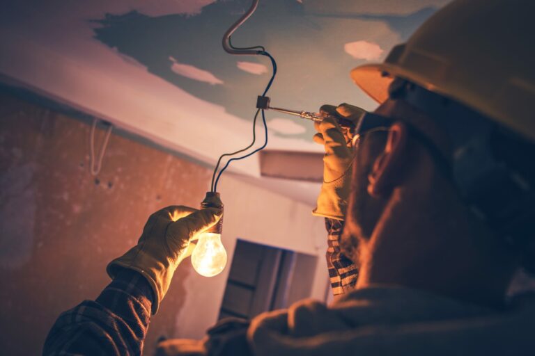 Electrician fixing a light